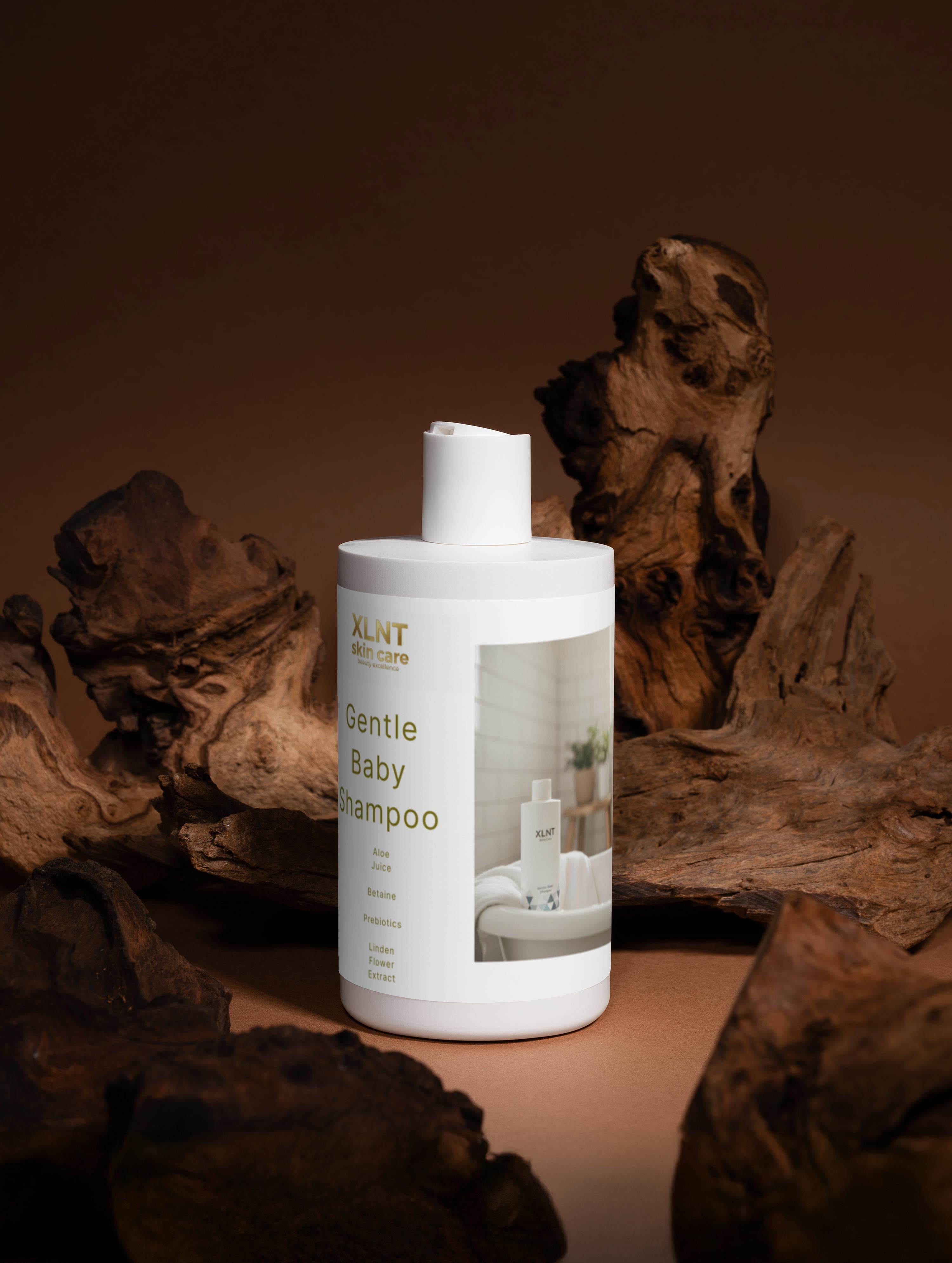 Mild baby shampoo bottle on wooden background, designed for gentle cleansing and organic baby care.